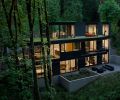 This three-level, four-bedroom, 4,422 square foot house abutting Portland’s Forest Park was completed by William / Kaven Architecture and Metcalf Design & Construction in 2023. The upper level offers green roofing.