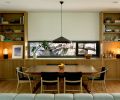 A window in the dining room provides a contrasting view, that of the rocky hillside.