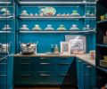 Casework by Stusser Woodworks in Benjamin Moore’s River Blue with Azul Adobe Limestone counter from Meta Marble & Granite.