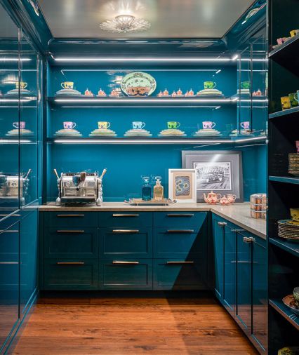 Casework by Stusser Woodworks in Benjamin Moore’s River Blue with Azul Adobe Limestone counter from Meta Marble & Granite.