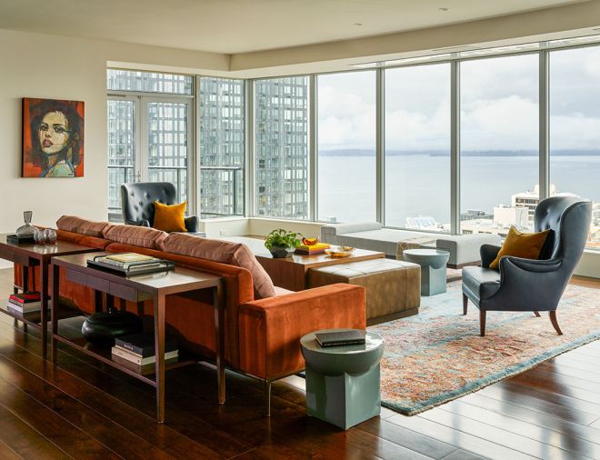 From Arden Home, custom wood consoles and oversized ottoman with sliding wood top. Custom two-toned sofa and suede frame from A. Rudin. Artistic Frame Montana Wingbacks and Andes Furniture Sophia Daybed from Kelly Forslund. Artwork by Oscar Solis.