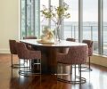 Custom oval dining table from Arden Home with RH chairs in Jim Thompson fabric from Trammell-Gagné.