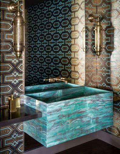 The striking hand-painted Bas Relief wall covering “Labrado” is from De Gournay. Waterworks Vintage brass faucet from Chown Hardware and Emerald Quartzite slab from Grandy Marble & Tile.