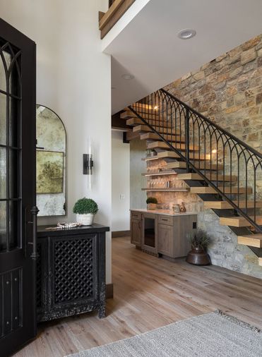 In Vladimir and Era Zayshlyy’s Suncadia home, the entry has a stone wall, composed of Glacier Mountain Ledgestone, and inspired by the couple’s travels to Croatia. The custom metal and wood staircase offers refined contrast.