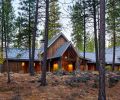 The exterior is covered in tight-knot cedar board and batten siding from Creative Woodworking, with Sierra Pacific windows. Dimensional bluestone pavers guide guests to the entry.