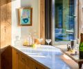 Polished Della Terra Quartz counters at the kitchen pass-through window.