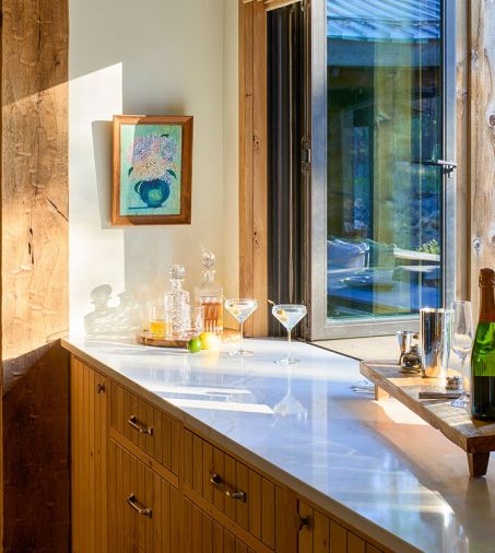 Polished Della Terra Quartz counters at the kitchen pass-through window.