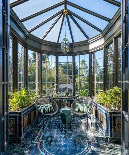 In serious need of restoration to reattach it to the historic home, the interior of the Orangerie also got a facelift, including new electrical to light the Diamond Pendant from Urban Electric. Original tile floors and planters were also restored.