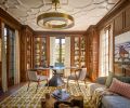 French polished original woodwork throughout and a Tom Faulkner Ava desk with Breccia Stone Top. Uptown chandelier William Sonoma Home. Custom window coverings from Groundworks and NIBA Tikal rug to echo original restored plaster molded ceiling. Lorae Settee with Casamance Niveal fabric.
