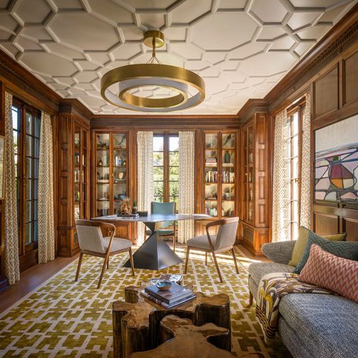 French polished original woodwork throughout and a Tom Faulkner Ava desk with Breccia Stone Top. Uptown chandelier William Sonoma Home. Custom window coverings from Groundworks and NIBA Tikal rug to echo original restored plaster molded ceiling. Lorae Settee with Casamance Niveal fabric.