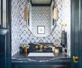 Stunning Shiori Blues wallcovering from Giardini is paired with Northwest Custom Interiors cabinetry, Lisa Jarvis Christopher pulls and Black Moon Marble counter.