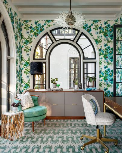 Cheerful Thibault Open Spaces wallpaper highlights a Bakalowits & Sohne Miracle Chandelier. An Anthropologie Bixby chair and RH Holden Side Table sit atop Hedgehog in Sea from The Rug Company.