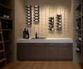 Cavassa designed the unique pin system using Vintage View Vino Pins for wine cellar display. Northwest Custom Interiors rift white oak cabinetry with Schwinn Hardware, Inc. and Emerald Pearl slab counter.