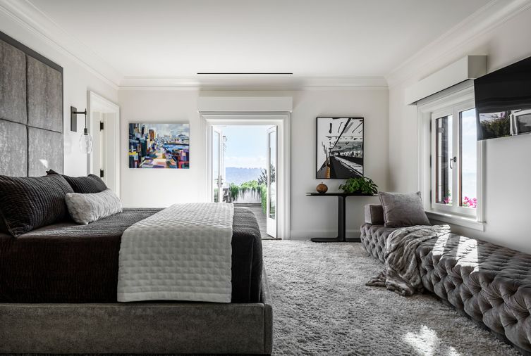 The Cielo Custom Sofa by Nathan Anthony is a favorite spot for Blair to take her morning coffee by the window, as is the exterior balcony. The custom bedframe and headboard is from Castellano Furniture in Portland, and the Ellisse Tempo Sconce from Hammerton.