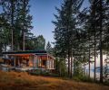 Local Western Red Cedar siding from Carl’s Building Supply has been painted a dark charcoal to minimize the visual impact of the highly textured wood. The powder-coated aluminum fascia from Miller Sheet Metal creates a framework for the green roof.