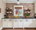 The multi-functional “butler’s pantry” connects the kitchen to the garage and outdoors. The custom open shelving is made of reclaimed wood from Salem Salvage and iron brackets from Restoration Hardware.