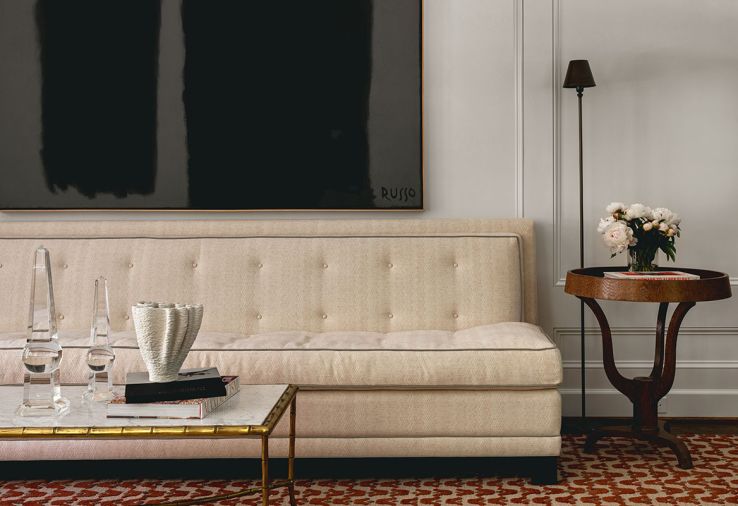 A triptych of artful furnishings begins with a vintage marble top coffee table graduating to a custom settee with Jane Churchill fabric all crowned by artist Michele Russo’s “Untitled Monoliths” from Russo Lee Gallery.