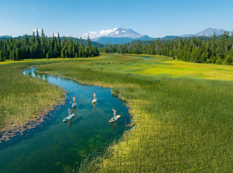 Standup paddle boarding (SUP) is a great way to glide along Hosmer Lake.