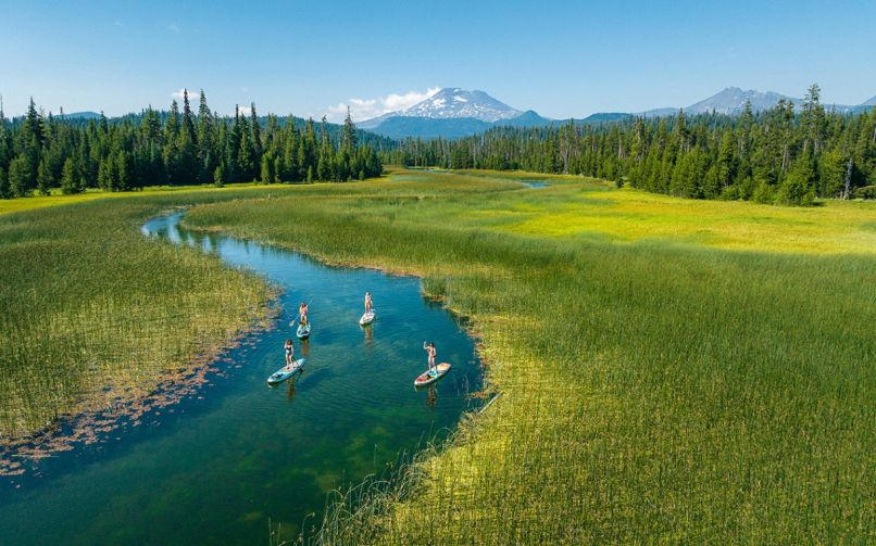 Standup paddle boarding (SUP) is a great way to glide along Hosmer Lake.