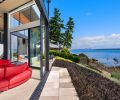 This home has a front row seat to nature’s play, thanks to a rear façade composed of Marlin Windows and Fleetwood Doors from Windows, Doors & More. “Even if it’s cold outside, we open the doors two inches,” says the owner.