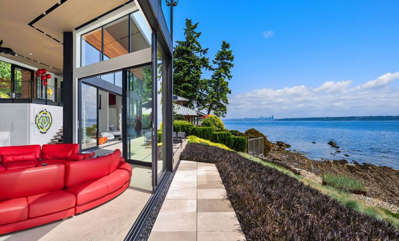 This home has a front row seat to nature’s play, thanks to a rear façade composed of Marlin Windows and Fleetwood Doors from Windows, Doors & More. “Even if it’s cold outside, we open the doors two inches,” says the owner.