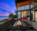 On the patio, a Paloform fireplace is surrounded by outdoor furniture by Richard Schultz from Design Within Reach. “Our favorite thing is that we really experience the weather and the seasons here,” says the owner.