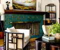 In the living room, a Janna Black Armchair sits with a Trio Nesting Coffee Table from Lulu and Georgia and antique rug from ABC Carpet and Home. Throughout, Benjamin Moore in Atrium White complements the woodwork.