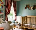 A child’s room has a jewel-toned palette and custom window treatments from Lesley Petty Studios.
