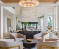 French Domaine “Sully” pavers from Exquisite Surfaces travel from poolside through family room and wine cellar beyond. Como Modular leather sofa from RH is kid-friendly, as is the RH Richards Trunk table. A pair of Tarbell Semi-Flush lighting from Arteriors crowns the room.