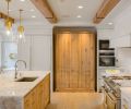 Crystallo Quartzite counters are lit by Visual Comfort Robinson Large Pendants. Appliances include Miele, Fisher & Paykel, Custom Caliber and True.