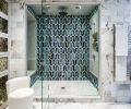 Ample walk-in shower features Ann Sacks Liberty Collection tile.
