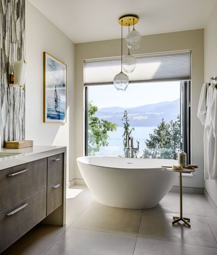 Hauser’s attention to detail and ability to create the right mood for every room extended to the spa-like vibe of the primary bath, with flooring by Statements Tile, an MTI tub with Brizo tub filler from Ferguson, and Avenue Lighting from Seattle Lighting