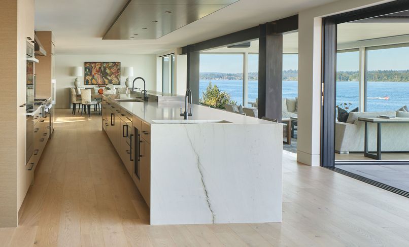 The steel moment frame is revealed off the relocated kitchen while Fleetwood sliders from Cherry Creek Windows & Doors opens to an extensive, yet welcoming deck.