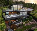 The newly remodeled home perches high above the water, with its four decks enjoying waterside views. Comfortable outdoor furnishings and fire features from RH are found on three of them.