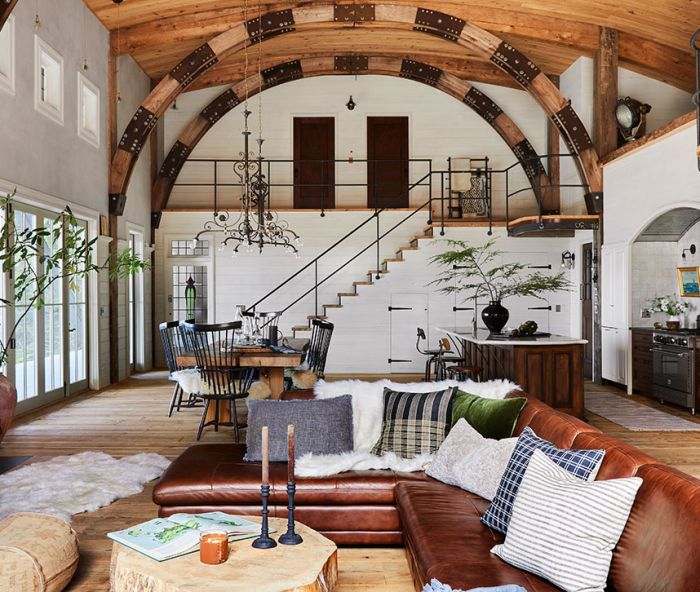 Anne designed the open plan’s large spaces with parties and festivities in mind. Stained glass windows enhance warm woods, white milk paint and tinted plaster walls.