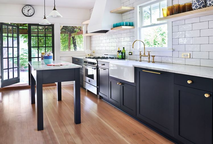 The kitchen was largely untouched as the former owner, also a local designer, featured custom cabinetry by Kokeena. Todd outfitted the open shelving with eclectic 90s diner-style dishes and glassware. Martindale updated the electrical throughout the home and installed a new HVAC system.