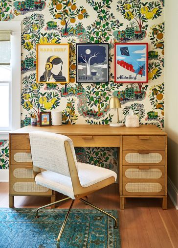 Jeff’s collection of Nada Surf band posters pops against the Schumacher “Citrus Garden” wallcovering. A Rue Cambon chair cozies up to a handsome Alegra desk.