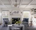 Since the owner loves both traditional and modern detailing, Lawton picked pieces that could bridge both. In the living room, a soapstone slab from Natural Stone Interiors surrounds the Real Fyre gas fireplace from Sutter Home & Hearth.