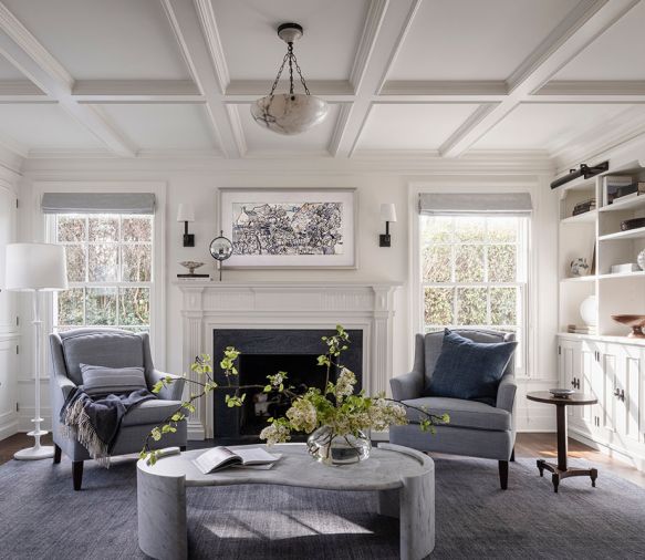 Since the owner loves both traditional and modern detailing, Lawton picked pieces that could bridge both. In the living room, a soapstone slab from Natural Stone Interiors surrounds the Real Fyre gas fireplace from Sutter Home & Hearth.