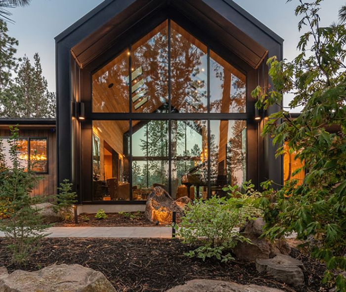 For the front facade, Island Sash & Door installed Weathershield windows and doors. The A-frame section, majestic in stature, is then wrapped in a metal roof and siding, adding weather protection from the harsh Central Oregon climate.
