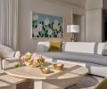 Highlighting the homeowner’s extensive art collection, including the Alex Katz artwork titled “White Roses”, are Isla coffee tables and a curved sofa from Dmitriy & Co in neutral tones.
