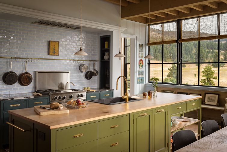 Taking cues from a vintage aesthetic, the kitchen feels collected rather than customized. Cabinets feature a variety of coordinated Benjamin Moore hues. Countertops are made of maple, black marble and zinc.