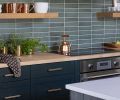 The handsome cabinets are painted in “Studio Green” which are adorned with satin brass Kent Knurled pulls and knobs from Sumner Street Home Hardware.