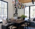 A chandelier fabricated with the homeowner’s vintage beer can collection is suspended over a walnut table built by the homeowner.