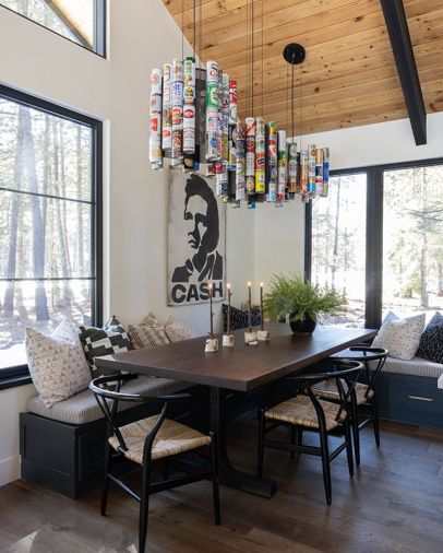 A chandelier fabricated with the homeowner’s vintage beer can collection is suspended over a walnut table built by the homeowner.