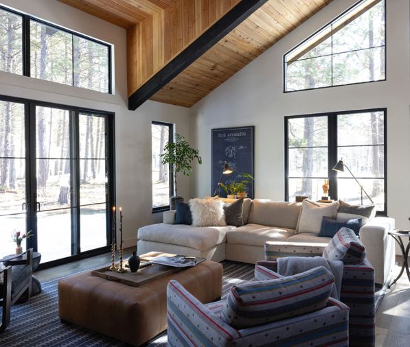Durable fabrics, like the performance-grade linen on the sofa, leather ottoman, and Pendleton Wool on the swivel chairs, are ready for laidback cabin life.