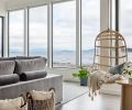 The rattan hanging chair is an invitation for some quiet time and a true beach view.