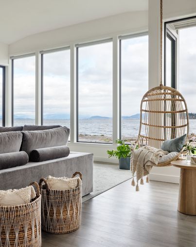 The rattan hanging chair is an invitation for some quiet time and a true beach view.