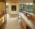 Upstairs, are his/hers custom desks by MADE, Inc., which parallels an Arne Vodder sideboard from 1stDibs. The Michele Russo artwork draws your eye to the view.