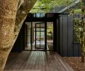 The modern aesthetic is set with board and batten exterior siding painted in Benjamin Moore “Onyx.” The black-framed windows and door by Marvin were sourced from Cherry Creek Windows & Doors.